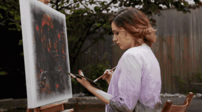 Woman Painting On Canvas On Easel GIF