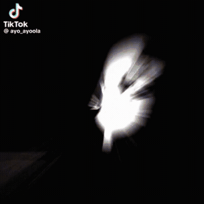 Woman Peeking From Back Of Car GIF