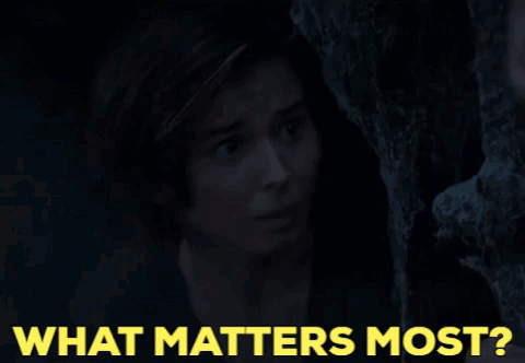 Woman Peeking From Behind Tree What Matters Most GIF
