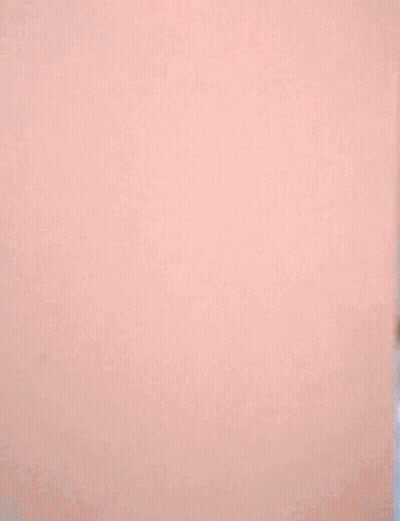 Woman Peeking From Behind Wall GIF