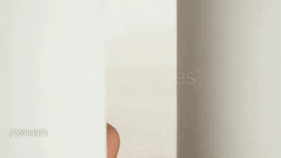 Woman Peeking Out of Hole Making Funny Face