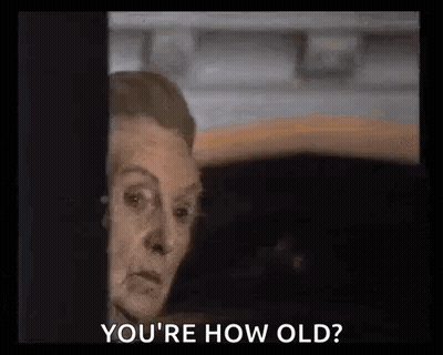 Woman Peeking Out Window Saying You're How Old GIF