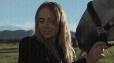 Woman Petting Horse In Field GIF