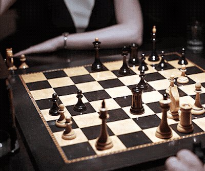 Woman Playing Chess GIF
