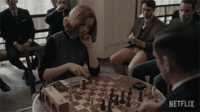 Woman Playing Chess With Netflix Logo GIF