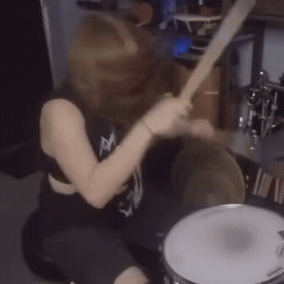 Woman Playing Drum Set With Evans Drum Head GIF