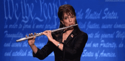 Woman Playing Flute Blue Background Saying We The People GIF