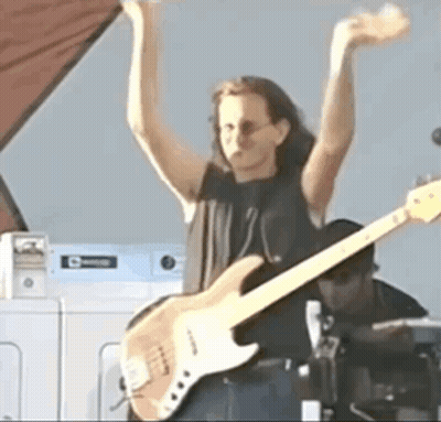 Woman Playing Guitar By Washing Machine GIF