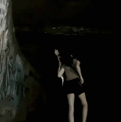 Woman Playing Guitar In Dark Room GIF