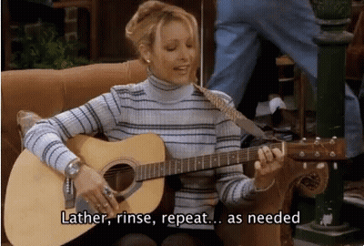 Woman Playing Guitar Saying Lather Rinse Repeat GIF