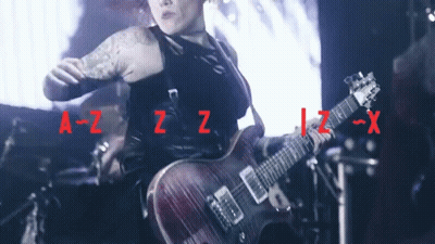 Woman Playing Guitar With Letters A-Z-Z-Z-X GIF