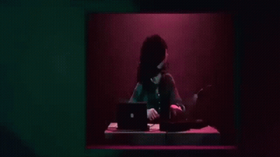 Woman Playing Keyboard In Dark Room GIF