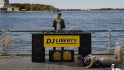 Woman Playing Music At DJ Liberty Stand GIF