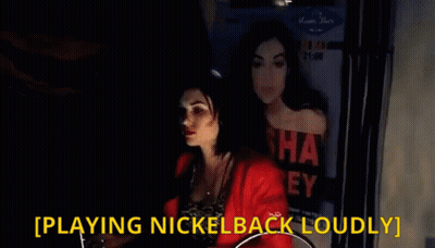 Woman Playing Nickelback Loudly In Front Of Poster GIF