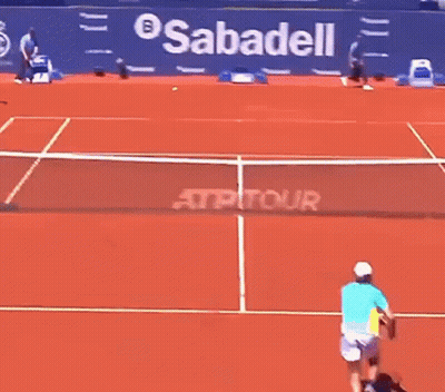 Woman Playing Tennis In Front Of BNP Pari Ad GIF