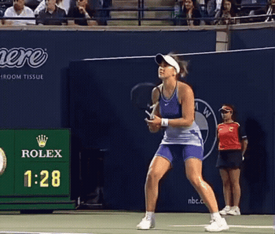 Woman Playing Tennis In Front Of Rolex Advertisement GIF