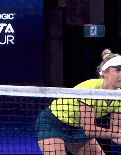 Woman Playing Tennis In Front Of Toyota Ad GIF