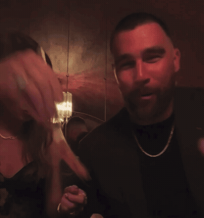 Woman Pointing At Man's Face In Mirror GIF