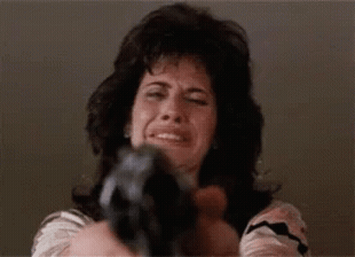 Woman Pointing Gun At Camera While Crying GIF