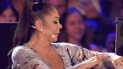 Woman Pointing In Front Of Microphone GIF