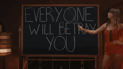 Woman Pointing To Blackboard: Everyone Will Betray You GIF