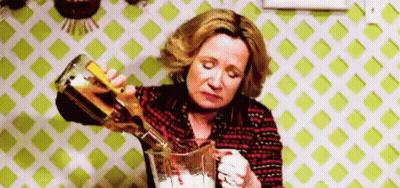 Woman Pouring Alcohol Into Blender GIF
