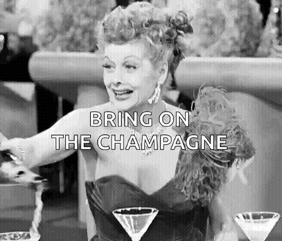 Woman Pouring Champagne Into Martini GIF