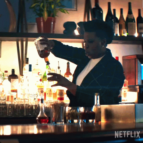 Woman Pouring Drink At Bar With Netflix GIF