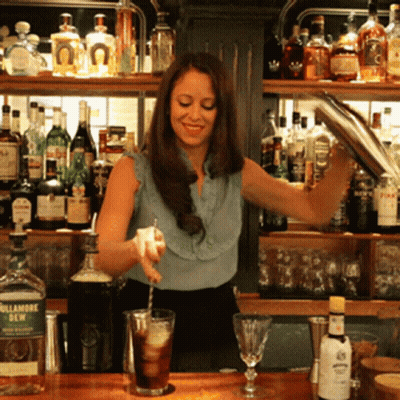 Woman Pouring Drink From Frontier Shaker GIF