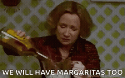 Woman Pouring Drink Into Glass GIF