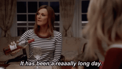 Woman Pouring Wine Says It Has Been A Reaaally Long Day GIF