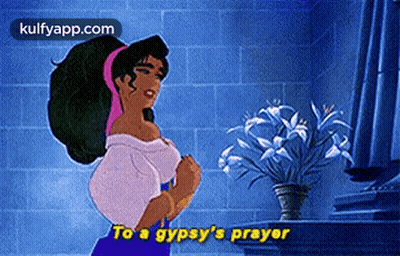 Woman Praying In Front Of Vase Of Flowers GIF