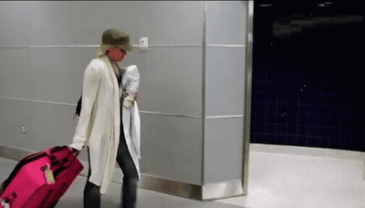 Woman Pulling Pink Suitcase GIF