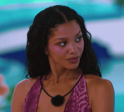 Woman Purple Top Black Necklace Looking At Camera GIF