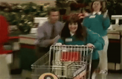Woman Pushing Shopping Cart In Store GIF