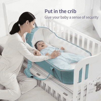 Woman Putting Baby In Crib With Text Put In The Crib Give Your Baby Security GIF