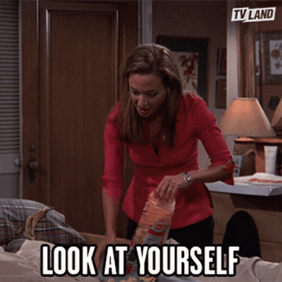 Woman Putting Bag Of Chips On Table GIF