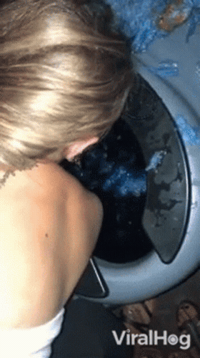 Woman Putting Clothes In Washing Machine Viralhog GIF