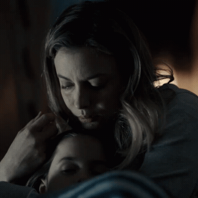 Woman Putting Hand On Child's Forehead GIF