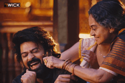 Woman Putting Hand On Man's Shoulder With Wick Logo GIF