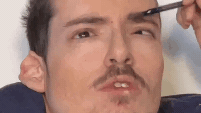 Woman Putting Hanger On Face GIF