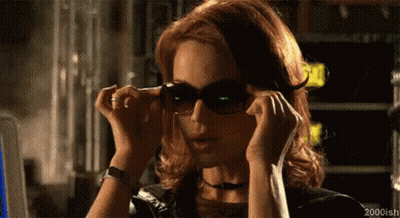 Woman Putting On Sunglasses GIF