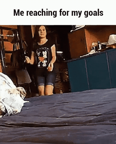 Woman Reaching For Goals On Bed GIF