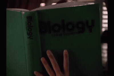 Woman Reading Biology Book GIF