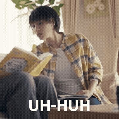 Woman Reading Book Saying Uh-Huh GIF