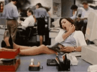Woman Reading Magazine Pretending To Work GIF