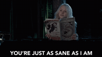 Woman Reading Magazine Saying You're Just As Sane As I Am GIF