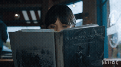 Woman Reading Pilgrim's Journey Book GIF