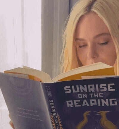 Woman Reading Sunrise On The Reaping GIF