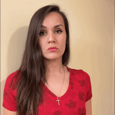 Woman Red Shirt Maple Leaves Cross Necklace GIF